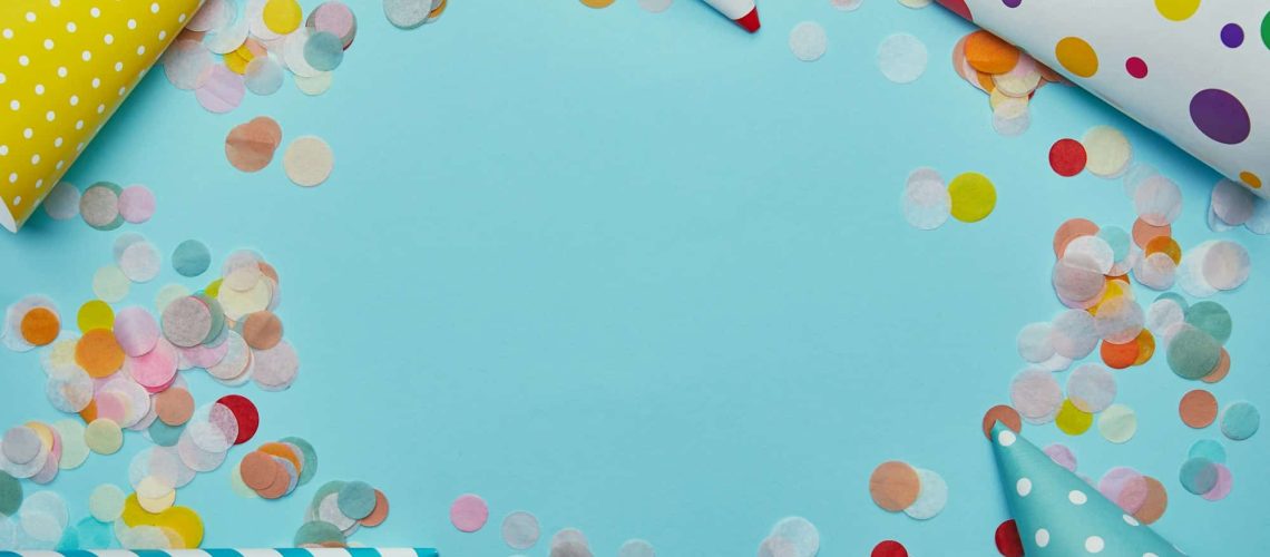 a group of party hats and confetti